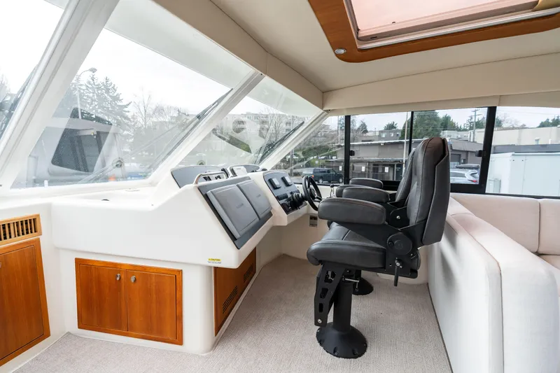 Slide: The Image of Interior helm of 2010 Maritimo M56 yacht with modern controls and seating. - 16