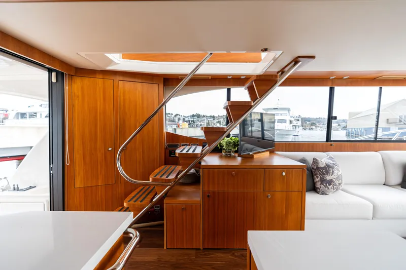 Slide: The Image of Luxurious interior of 2010 Maritimo M56 yacht with wooden finishes and modern furnishings. - 23