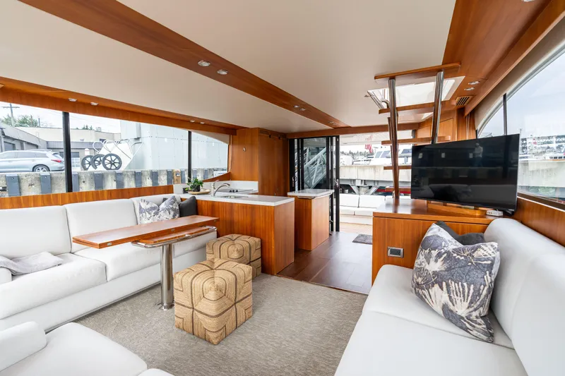 Slide: The Image of Luxurious interior of 2010 Maritimo M56 yacht with modern furnishings and large windows. - 5