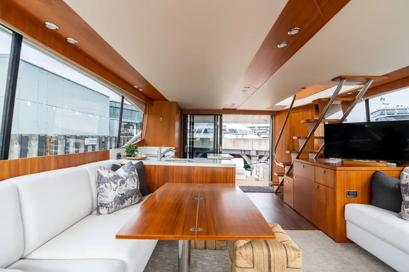 Slide: The Image of Luxurious interior of 2010 Maritimo M56 yacht with modern furnishings and large windows. - 6