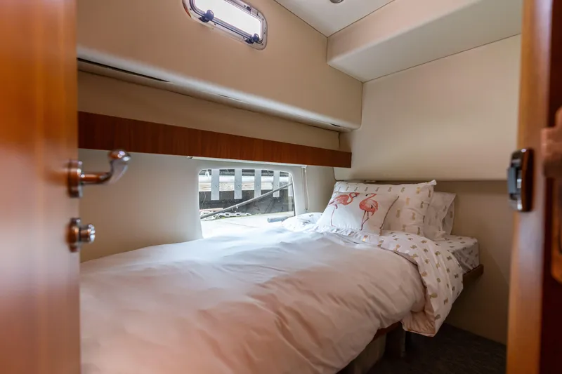 Slide: The Image of Cozy bedroom in 2010 Maritimo M56 yacht with window view and comfortable bedding. - 8