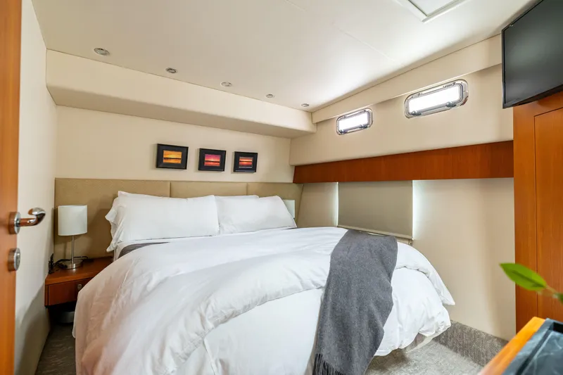 Slide: The Image of Luxurious bedroom interior of 2010 Maritimo M56 yacht with modern decor and cozy bedding. - 9