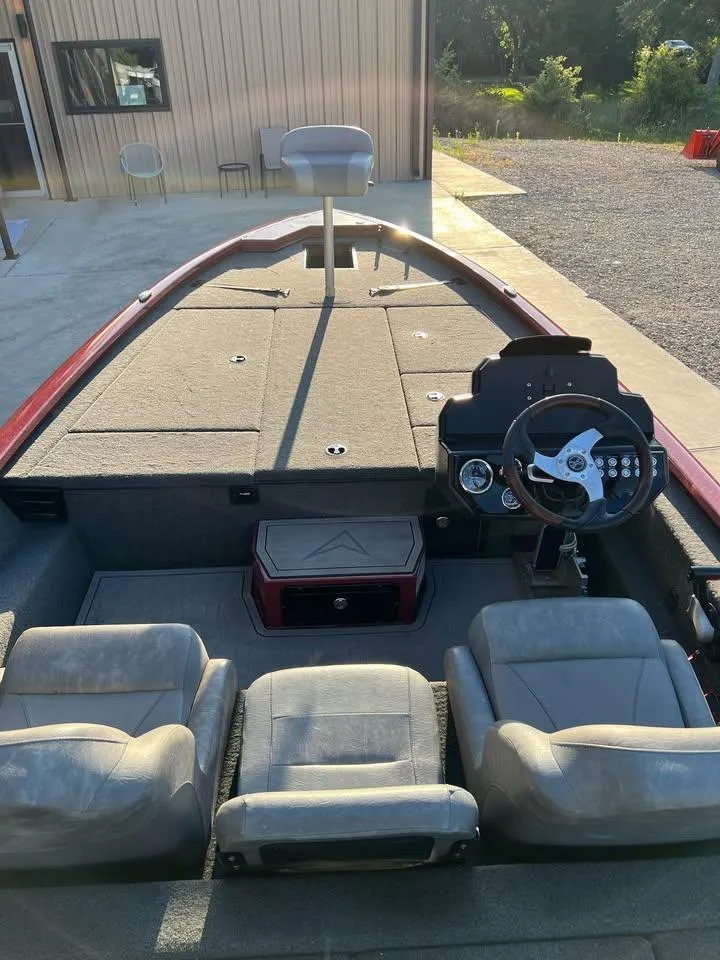 Slide: The Image of 2024 Avid 20 XB boat interior with steering wheel and seating. - 15