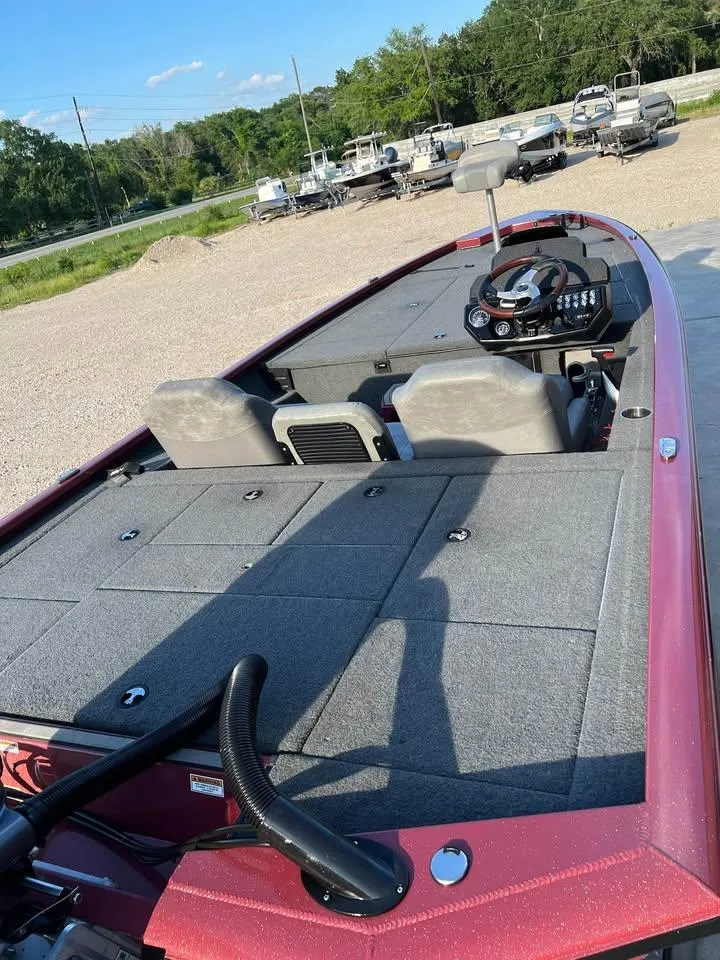 Slide: The Image of 2024 Avid 20 XB boat with spacious deck and modern steering console. - 9