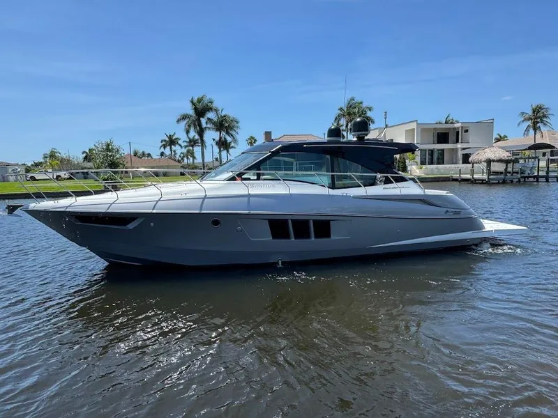 Slide: The Image of 2014 Cruisers Yachts 45 Cantius Black Diamond on water, with modern design and sleek profile. - 1