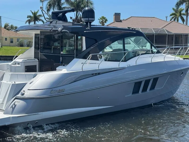 Slide: The Image of 2014 Cruisers Yachts 45 Cantius Black Diamond on water, sleek design, sunny day. - 10