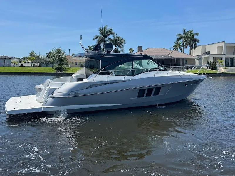 Slide: The Image of 2014 Cruisers Yachts 45 Cantius Black Diamond on a sunny waterfront. - 12