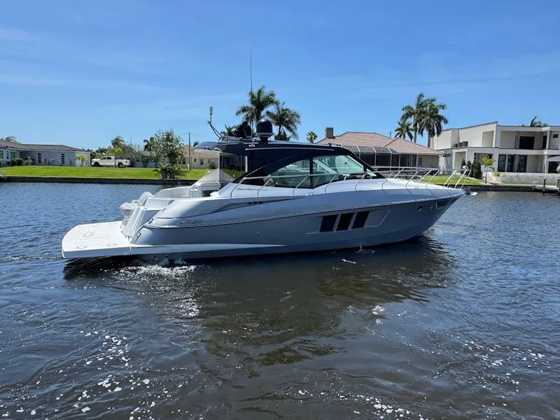 Slide: The Image of 2014 Cruisers Yachts 45 Cantius Black Diamond on a sunny waterfront. - 13