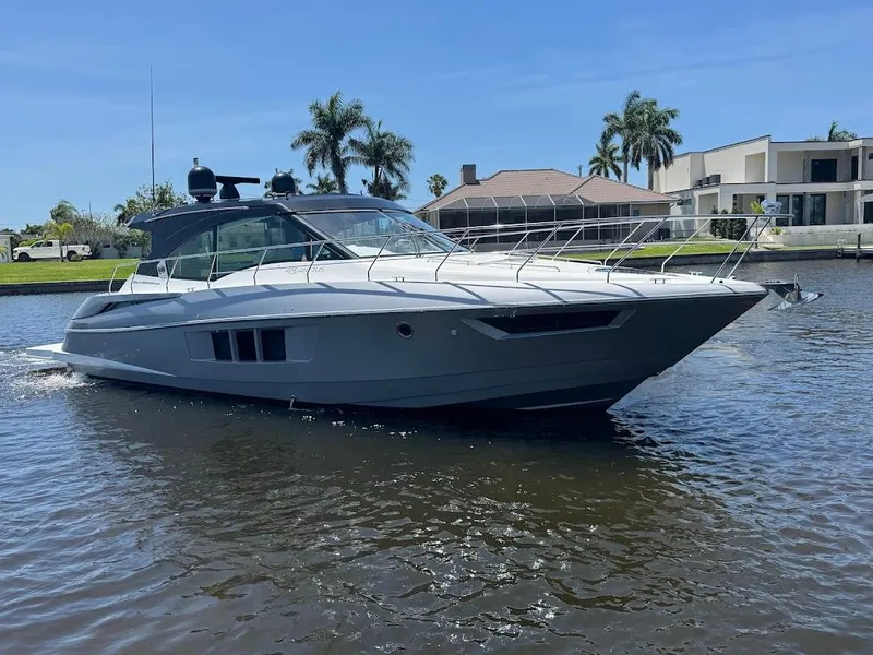 Slide: The Image of 2014 Cruisers Yachts 45 Cantius Black Diamond on water, with modern design and sleek lines. - 14