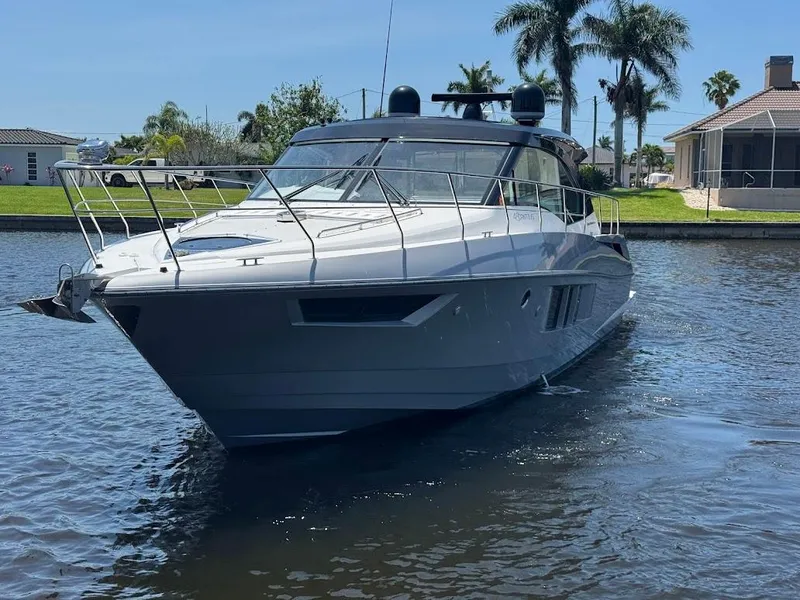 Slide: The Image of 2014 Cruisers Yachts 45 Cantius Black Diamond on a sunny waterfront. - 15