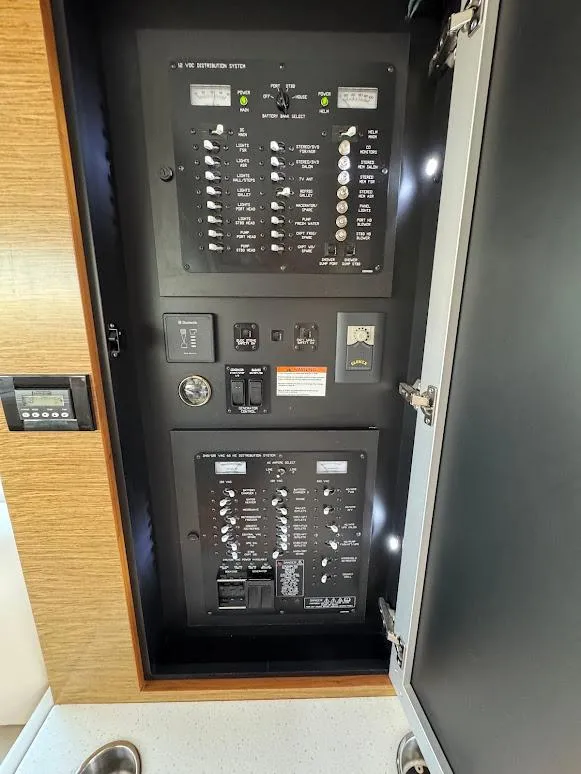 Slide: The Image of Electrical panel inside 2014 Cruisers Yachts 45 Cantius Black Diamond. - 20