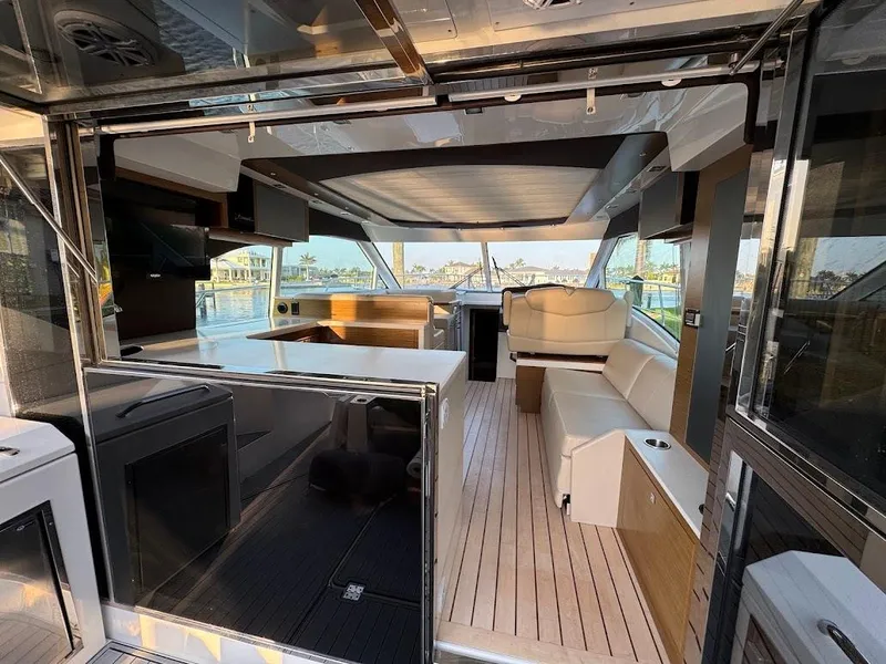 Slide: The Image of 2014 Cruisers Yachts 45 Cantius Black Diamond interior with modern seating and panoramic windows. - 22