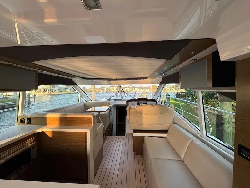 Slide: The Image of Luxurious interior of 2014 Cruisers Yachts 45 Cantius Black Diamond with modern seating and helm. - 24