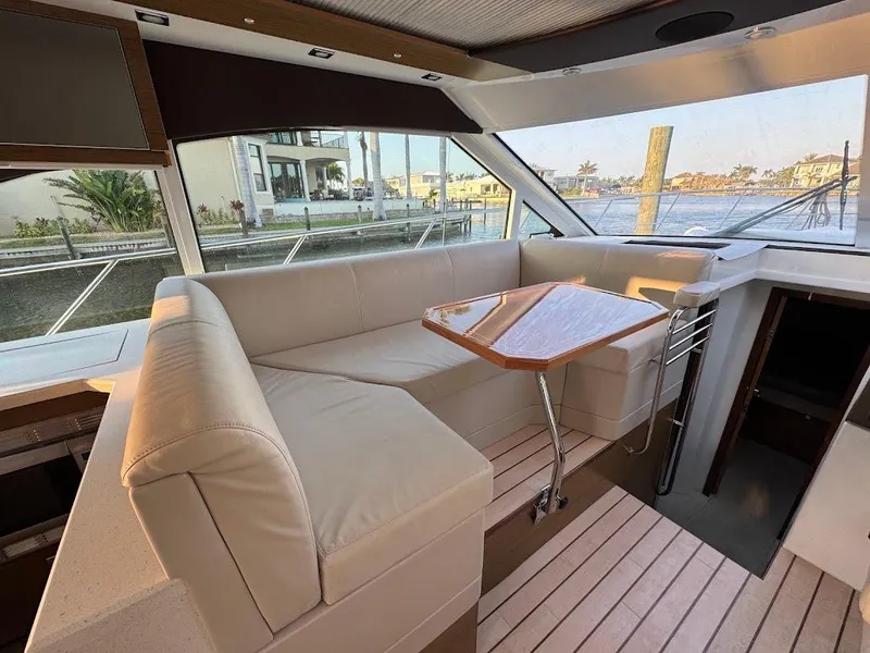 Slide: The Image of Interior of 2014 Cruisers Yachts 45 Cantius Black Diamond with elegant seating and table. - 25