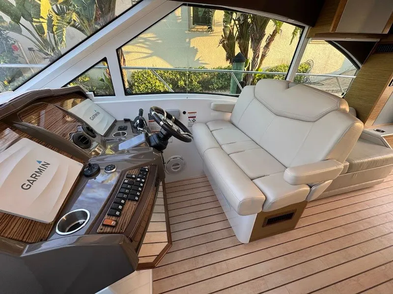 Slide: The Image of 2014 Cruisers Yachts 45 Cantius Black Diamond helm with Garmin system and plush seating. - 27