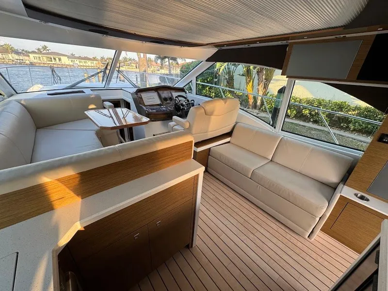Slide: The Image of Luxurious interior of 2014 Cruisers Yachts 45 Cantius Black Diamond with elegant seating and helm. - 29
