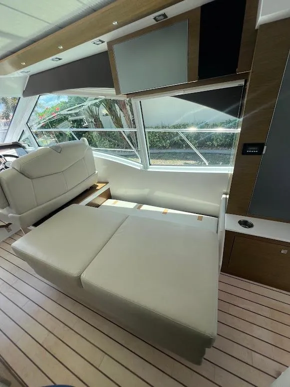 Slide: The Image of 2014 Cruisers Yachts 45 Cantius Black Diamond interior with modern seating and large windows. - 30