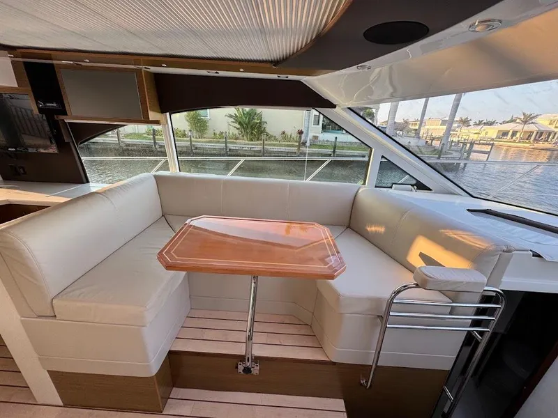 Slide: The Image of Luxurious interior of 2014 Cruisers Yachts 45 Cantius Black Diamond with elegant seating and table. - 32