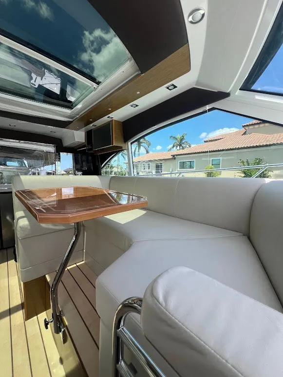 Slide: The Image of Luxurious interior of 2014 Cruisers Yachts 45 Cantius Black Diamond with skylight and plush seating. - 33