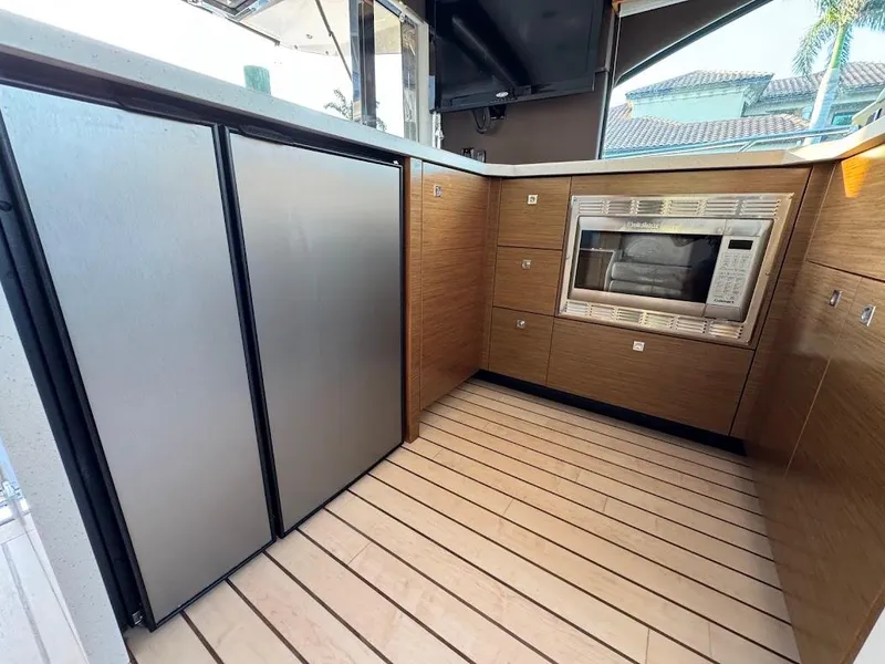 Slide: The Image of Modern kitchen area on 2014 Cruisers Yachts 45 Cantius Black Diamond with stainless appliances. - 37