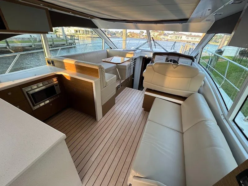 Slide: The Image of Luxurious interior of 2014 Cruisers Yachts 45 Cantius Black Diamond with modern seating and kitchen. - 39