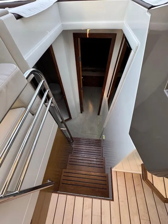 Slide: The Image of Stairway on 2014 Cruisers Yachts 45 Cantius Black Diamond, leading to cabin interior. - 40