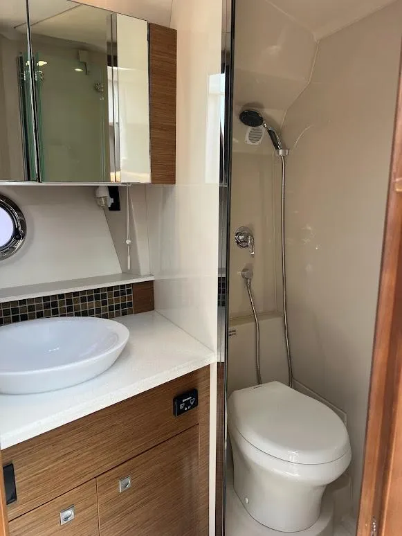 Slide: The Image of Luxurious bathroom in 2014 Cruisers Yachts 45 Cantius Black Diamond with modern fixtures. - 43