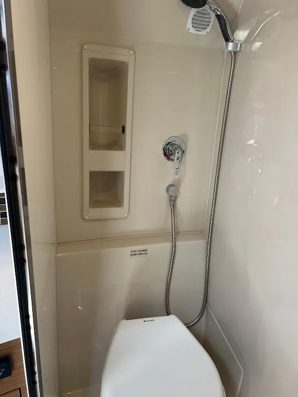 Slide: The Image of Bathroom interior of 2014 Cruisers Yachts 45 Cantius Black Diamond with shower and toilet. - 45
