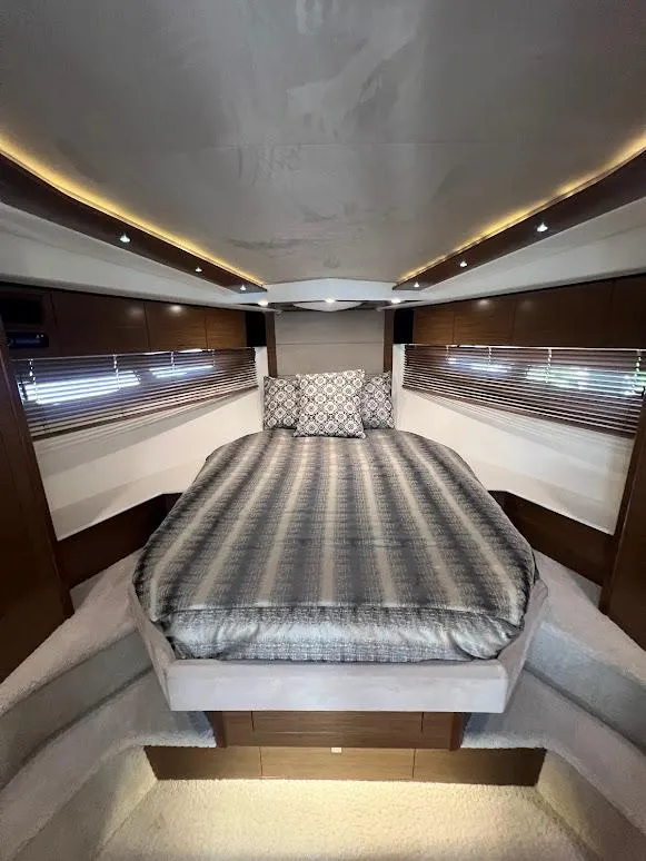 Slide: The Image of Luxurious interior of 2014 Cruisers Yachts 45 Cantius Black Diamond with elegant bedding. - 49