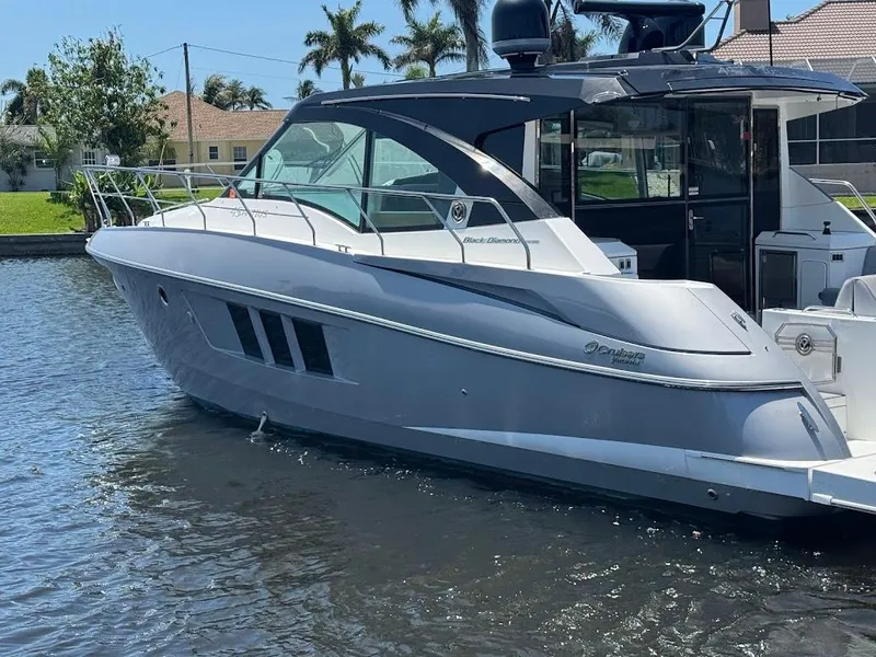 Slide: The Image of 2014 Cruisers Yachts 45 Cantius Black Diamond on water, sleek design, luxury motor yacht. - 8