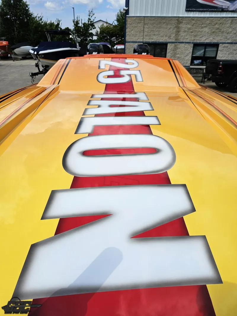 Slide: The Image of 2019 Hustler 25 Talon Cat boat with bold lettering on deck. - 22
