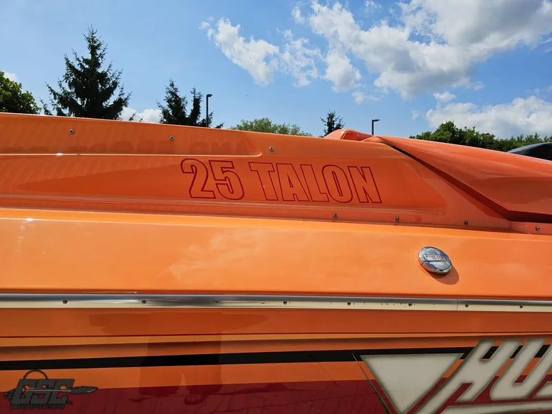 Slide: The Image of Orange 2019 Hustler 25 Talon Cat boat with clear sky background. - 33