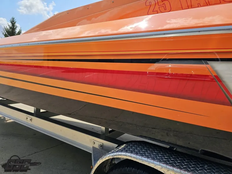 Slide: The Image of 2019 Hustler 25 Talon Cat boat with vibrant orange and red detailing. - 34