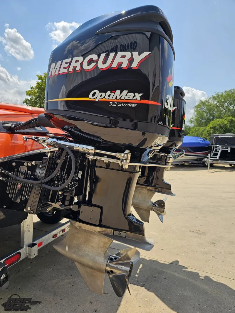 Slide: The Image of 2019 Hustler 25 Talon Cat with Mercury OptiMax 3.2 Stroker engines, outdoor setting. - 40
