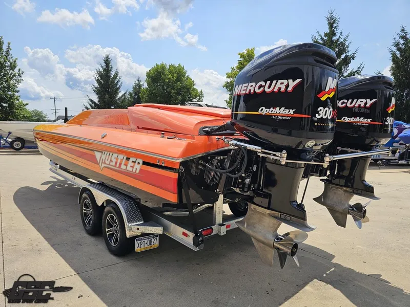 Slide: The Image of 2019 Hustler 25 Talon Cat boat with dual Mercury OptiMax 300X engines on a trailer. - 42