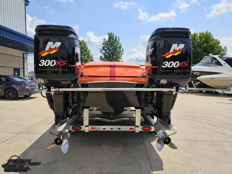 Slide: The Image of 2019 Hustler 25 Talon Cat with twin 300XS outboard engines on a trailer. - 44
