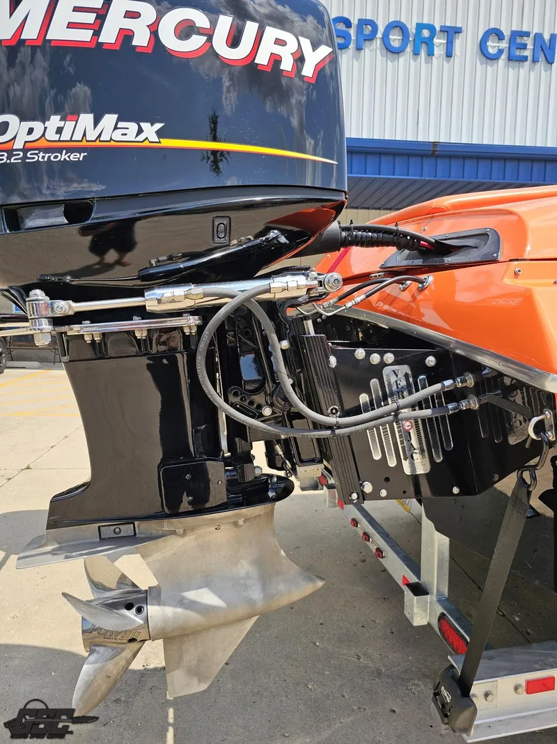 Slide: The Image of 2019 Hustler 25 Talon Cat with Mercury OptiMax engine at a sport center. - 45