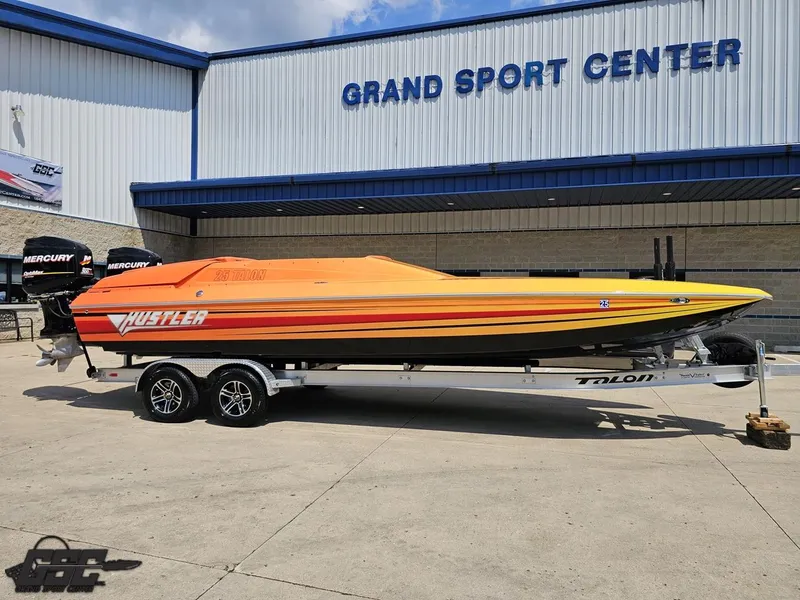 Slide: The Image of 2019 Hustler 25 Talon Cat boat with vibrant orange-yellow design at Grand Sport Center. - 5