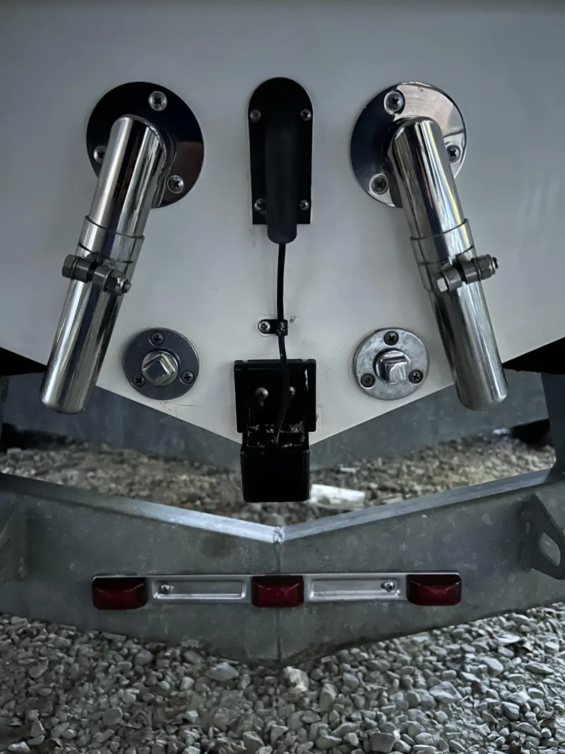 Slide: The Image of Rear view of a 2002 Cigarette Top Gun boat with dual exhaust pipes. - 17