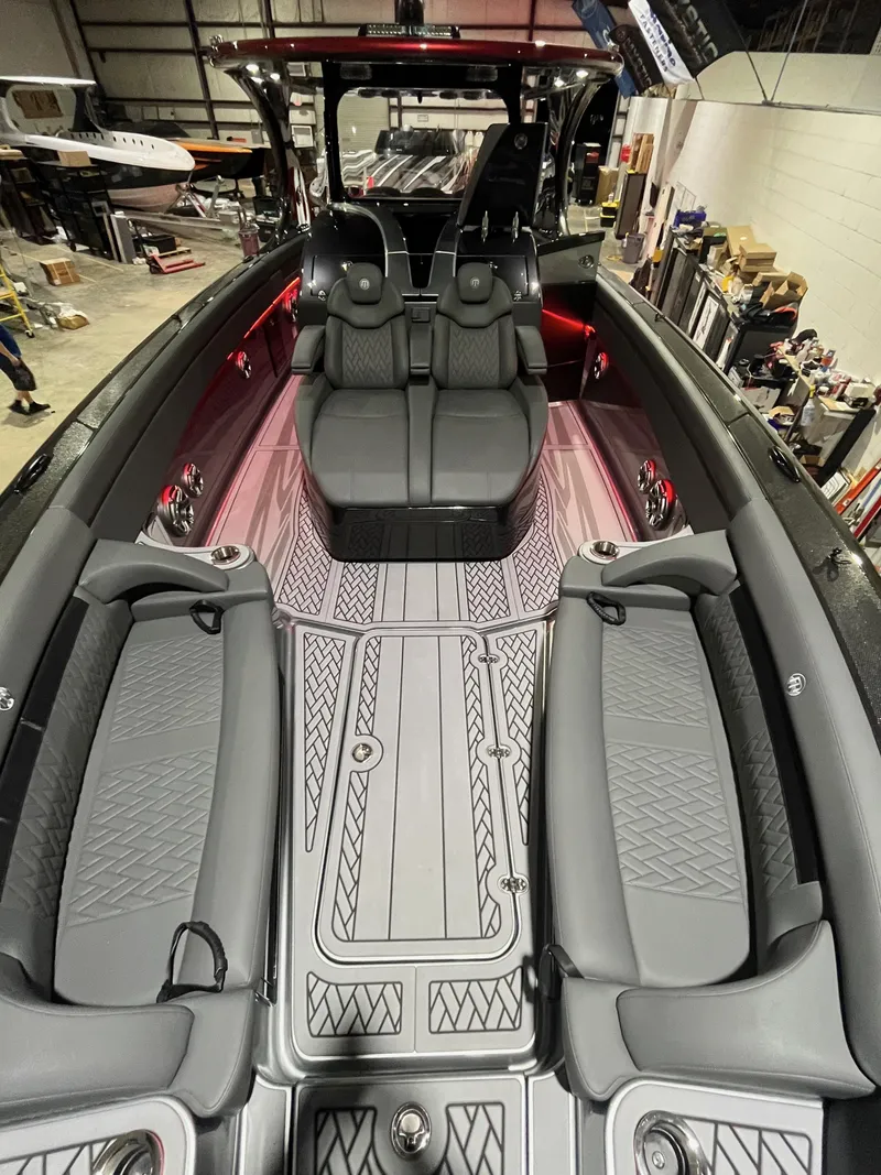 Slide: The Image of 2025 Mystic Powerboats M4200 interior with luxurious seating and modern design. - 4