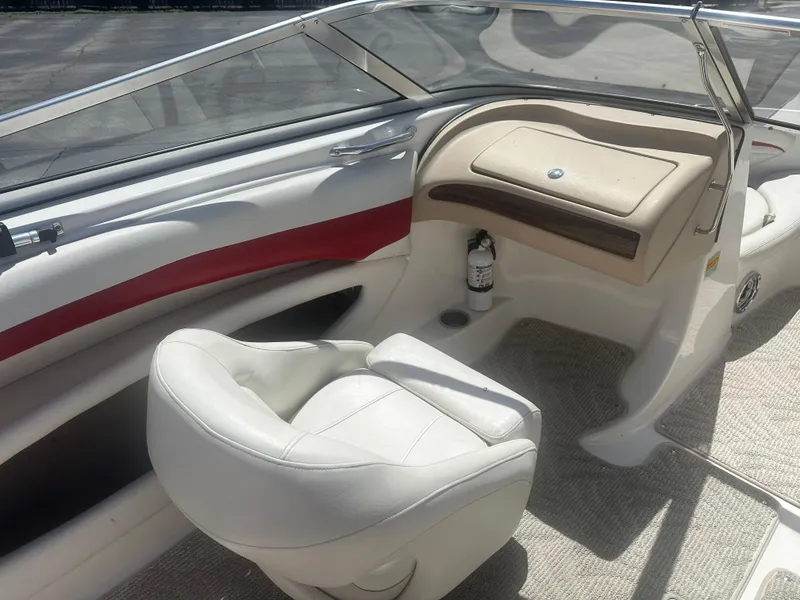 Slide: The Image of 2008 Glastron 205 GX boat interior with white seating and dashboard. - 11