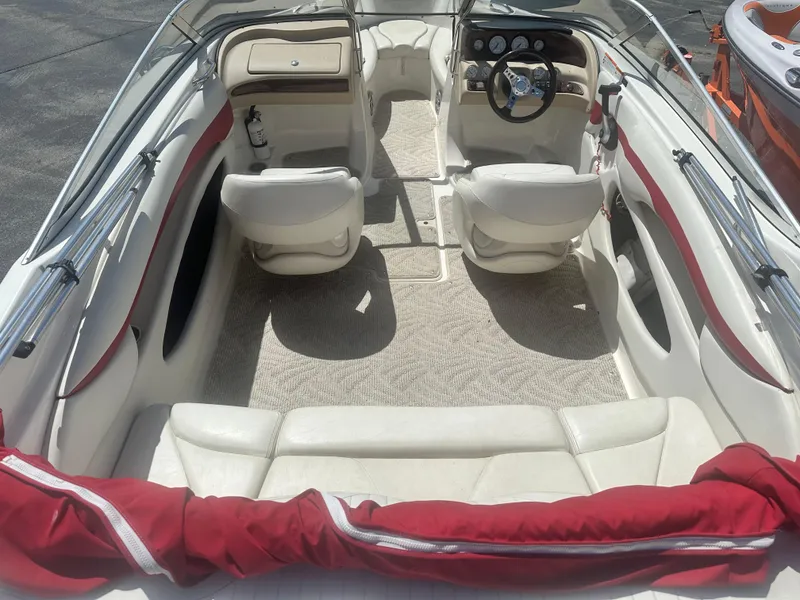 Slide: The Image of 2008 Glastron 205 GX boat interior with white seating and red accents. - 8