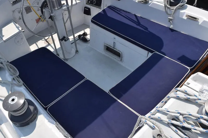 Slide: The Image of Cockpit of 1981 C&C 37 sailboat with blue cushions and steering wheel. - 11