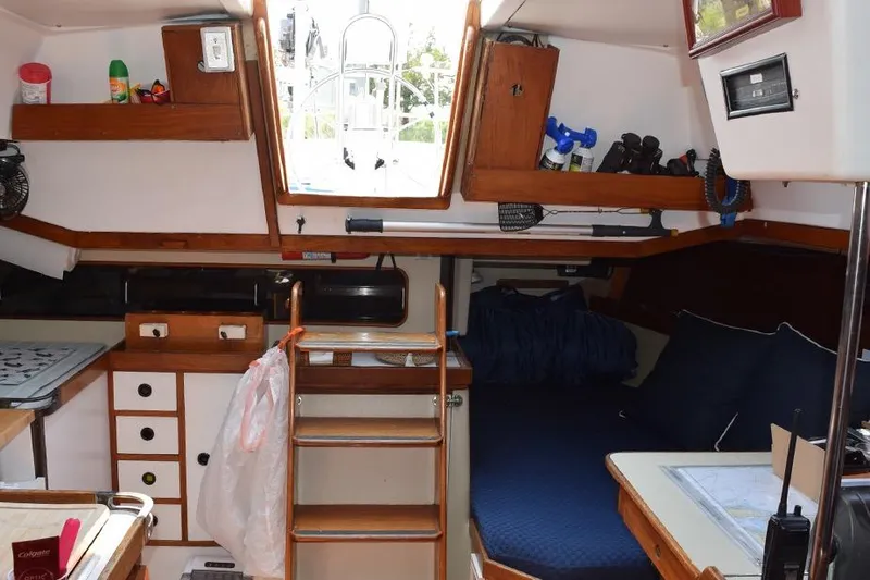 Slide: The Image of Interior of a 1981 C&C 37 sailboat with cozy cabin and wooden accents. - 18