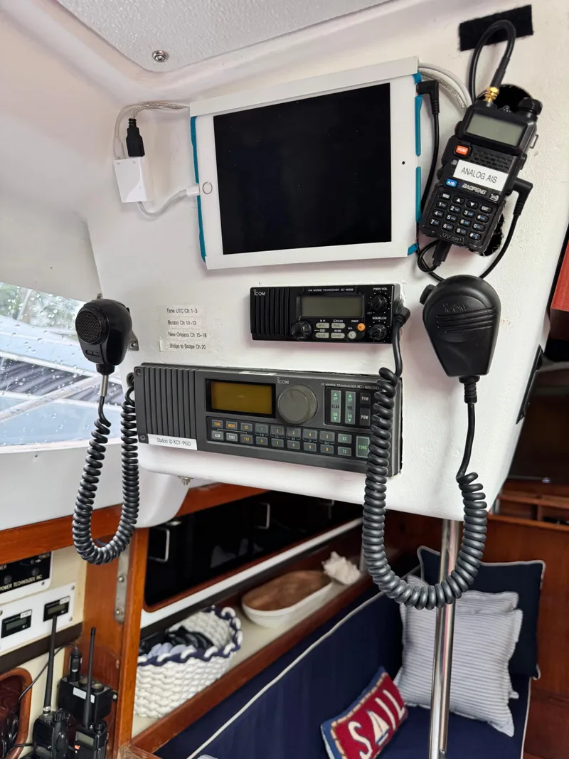 Slide: The Image of Interior of a 1981 C&C 37 sailboat with communication equipment and tablet. - 28