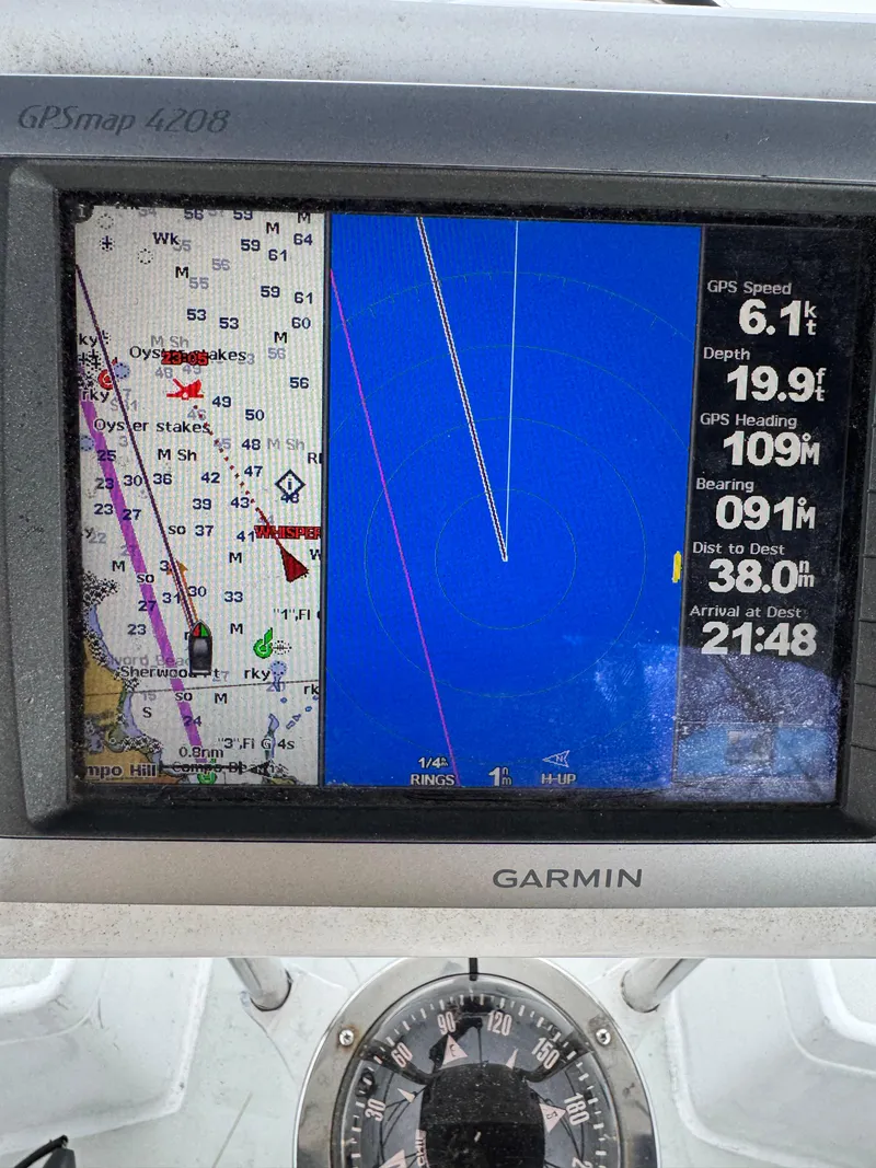 Slide: The Image of Garmin GPS display on a 1981 C&C 37 sailboat showing navigation data. - 32