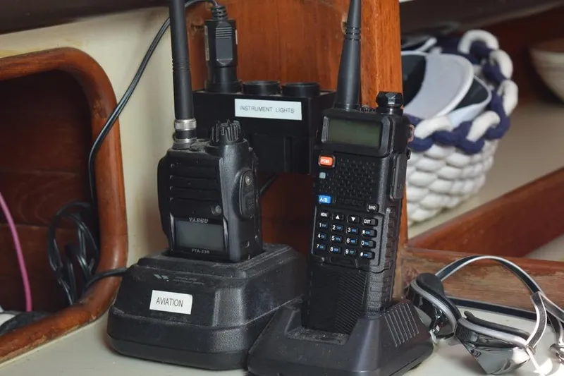 Slide: The Image of Two-way radios and sunglasses on a 1981 C&C 37 sailboat interior. - 40