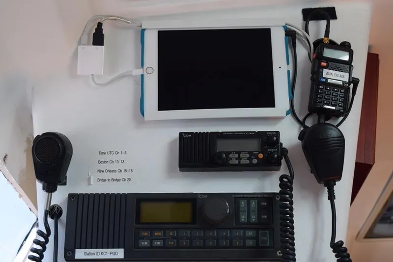 Slide: The Image of Boat communication equipment setup with tablet and radios on a 1981 C&C 37 sailboat. - 41