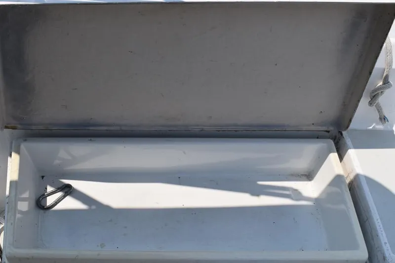 Slide: The Image of Open storage compartment on 1981 C&C 37 sailboat with carabiner inside. - 54