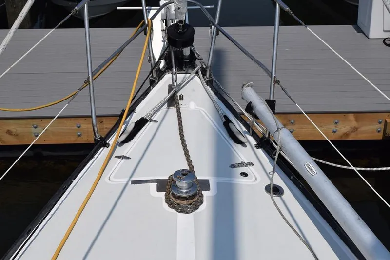 Slide: The Image of Bow of 1981 C&C 37 sailboat with anchor chain and winch. - 8